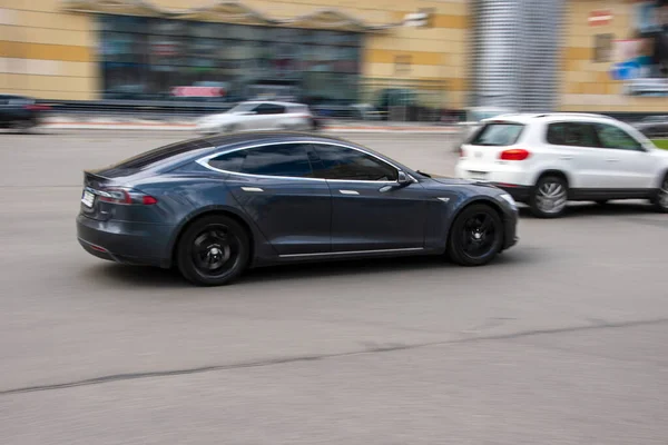 stock image Ukraine, Kyiv - 26 April 2021: Gray TESLA Model S car moving on the street. 