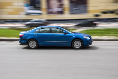Ukraine, Kyiv - 26 April 2021: Blue BYD F3 car moving on the street. 