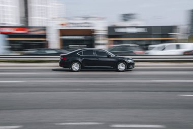 Ukraine, Kyiv - 29 April 2021: Black Skoda Superb car moving on the street. Editorial