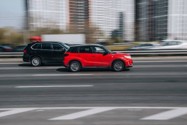 Ukraine, Kyiv - 29 April 2021: Red Suzuki Vitara car moving on the street. Editorial