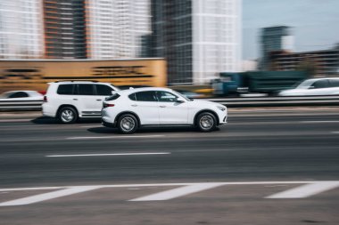Ukraine, Kyiv - 29 April 2021: White Alfa Romeo Stelvio car moving on the street. Editorial