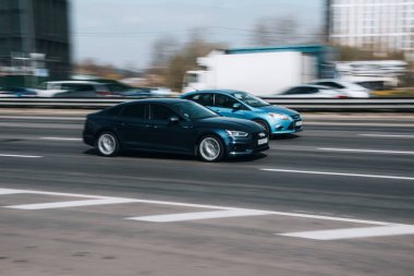 Ukraine, Kyiv - 29 April 2021: Blue Audi A5 car moving on the street. Editorial