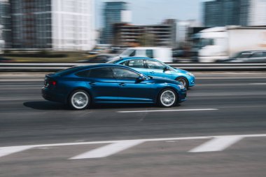 Ukraine, Kyiv - 29 April 2021: Blue Audi A5 car moving on the street. Editorial