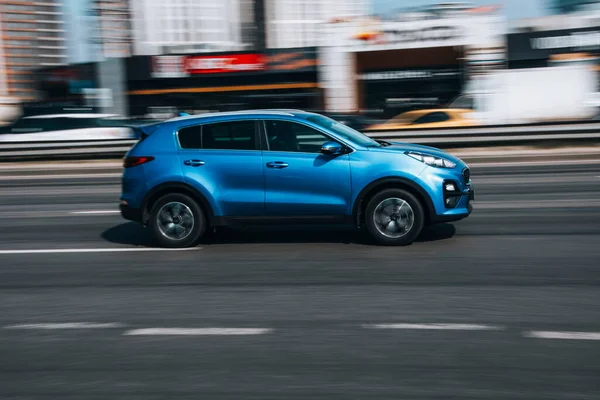 Ukraine, Kyiv - 29 April 2021: Light Blue KIA Sportage car moving on the street. Editorial