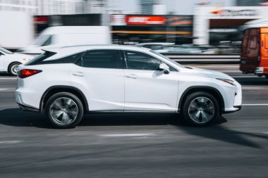 Ukraine, Kyiv - 29 April 2021:  White Lexus RX car moving on the street. Editorial