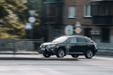 Ukraine, Kyiv - 16 July 2021: Gray Lexus RX car moving on the street. Editorial