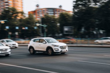 Ukraine, Kyiv - 16 July 2021: White Hyundai Tucson car moving on the street. Editorial