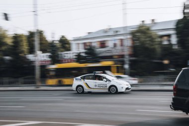 Ukraine, Kyiv - 16 July 2021: White Toyota Prius Patrol Police car moving on the street. Editorial