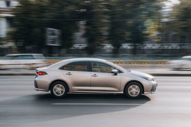 Ukraine, Kyiv - 16 July 2021: Silver Toyota Corolla car moving on the street. Editorial