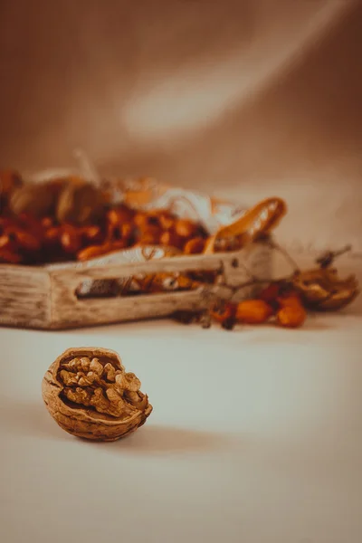 Warm Autumn still life with walnuts — Stock Photo, Image