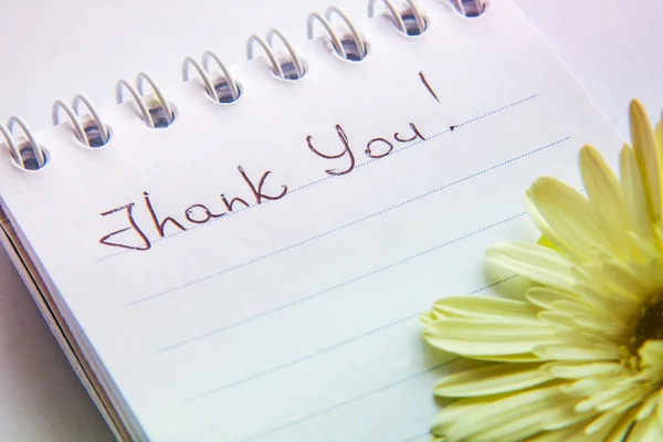 Hand writting text "Thank You" on a white page and romantic flow — Stock Photo, Image