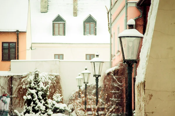 Stylized brown photo of the old city street in winter. Zamosc, P — Stock Photo, Image