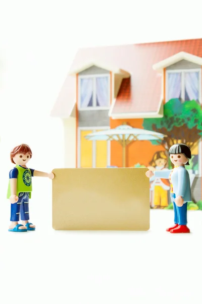 Plast leksak med golden kort — Stockfoto