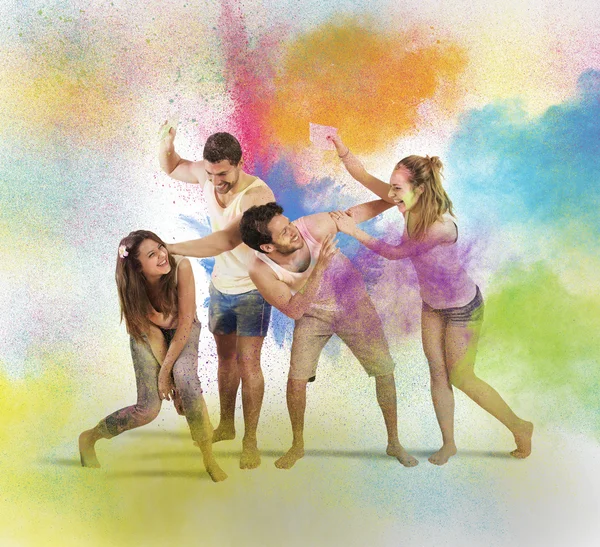 Friends having fun with colored powders — Stock Photo, Image