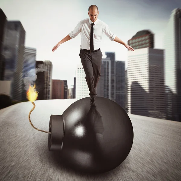 Businessman walks over bomb — Stock Photo, Image