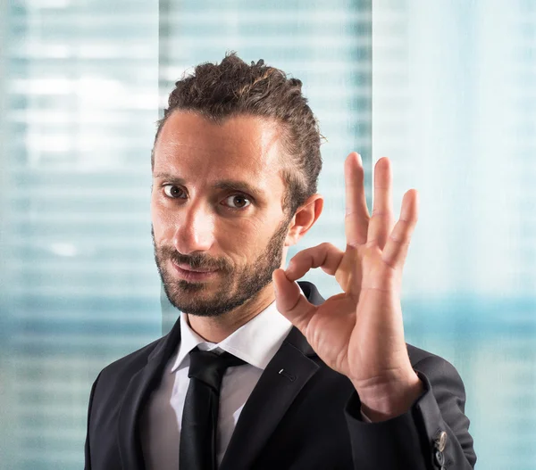 Businessman makes ok gesture — Stock Photo, Image