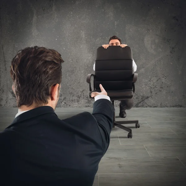 Employee hiding behind chair — Stock Photo, Image