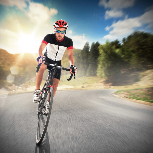 Cyclist cycling on road