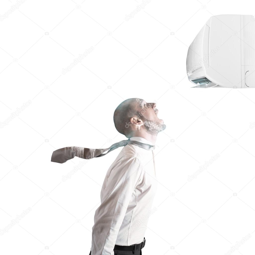 Businessman frozen by the air conditioner