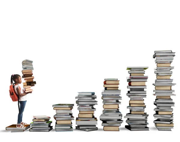 Niño subiendo las escaleras hechas de libros — Foto de Stock