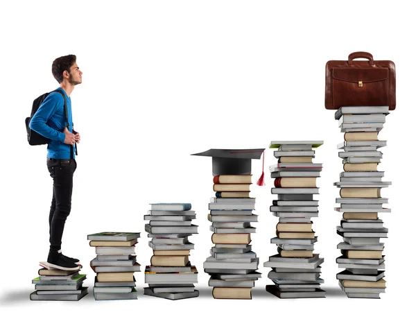 Boy climbing the stairs made of books — Stock Photo, Image