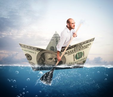 İşadamı bir banknot tekne