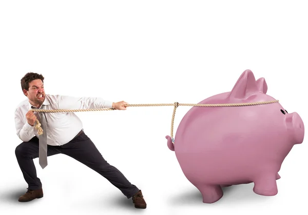 Affärsman drar linan med en piggybank — Stockfoto