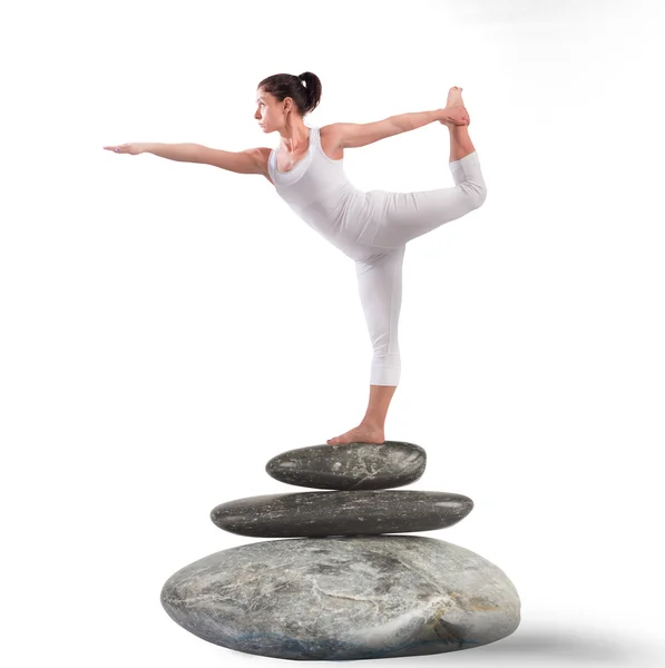 Woman in a pilates position on rock — Stock Photo, Image