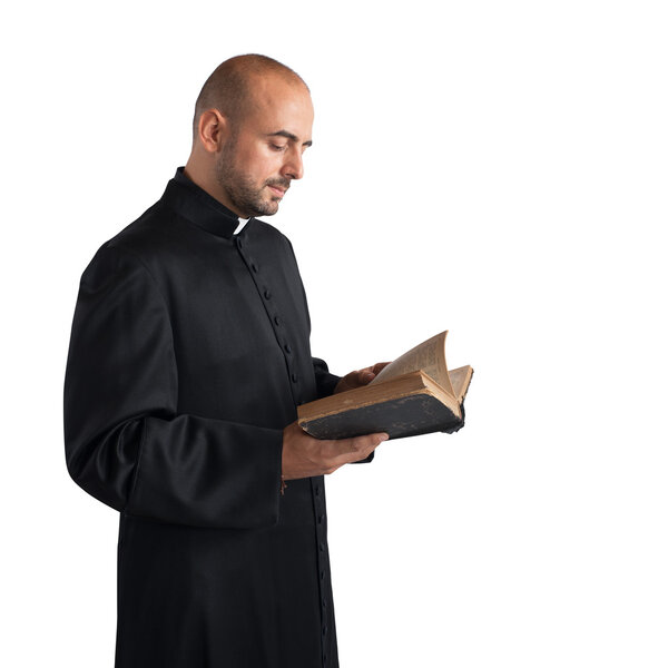 Man priest reads the bible 