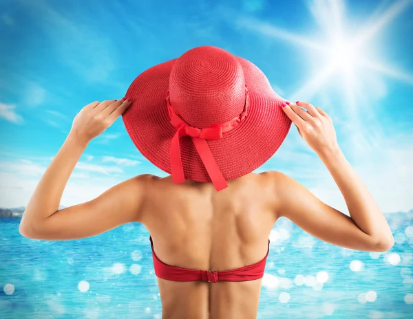 Woman with red straw hat — Stock Photo, Image