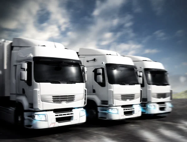 Three white articulated trucks — Stock Photo, Image