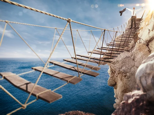 3D Rendering of Man rejoices at the end of the crumbling bridge — Stock Photo, Image
