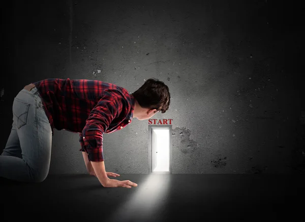 Man looking door on the wall — Stock Photo, Image