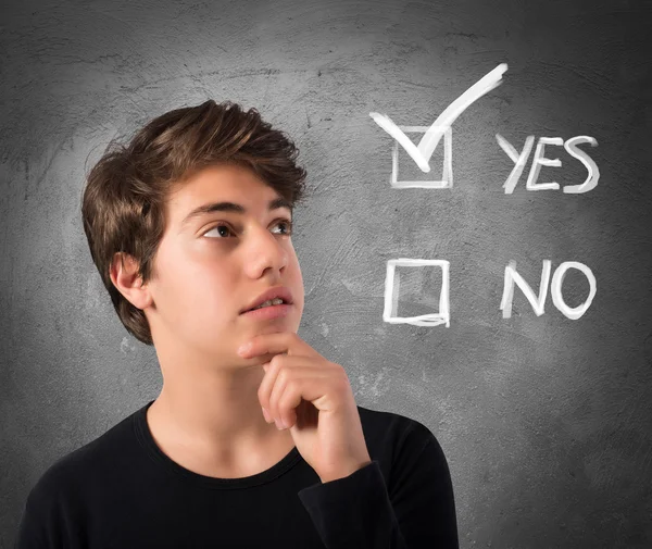 Teenage Boy with yes or no checkboxes — Stock Photo, Image