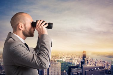 Businessman looking at the city landscape clipart
