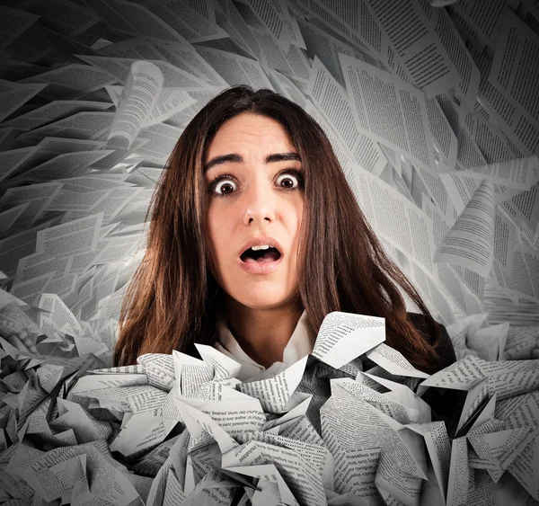 Businesswoman submerged by   the working documents — Stock Photo, Image