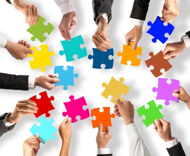 people holding the colorful puzzle pieces clipart