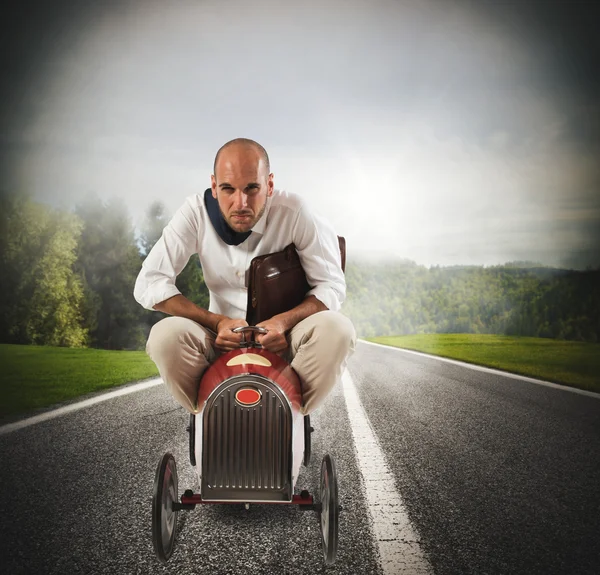 Businessman driving a small  car — Stock Photo, Image