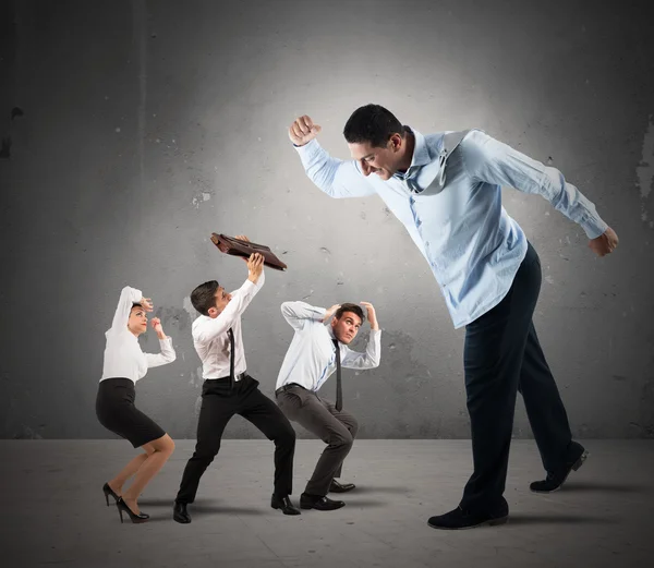 Big boss intimidating little employees — Stock Photo, Image