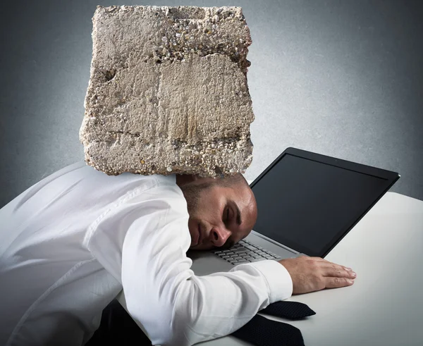 Businessman sleeping on a computer keyboard — Stock Photo, Image