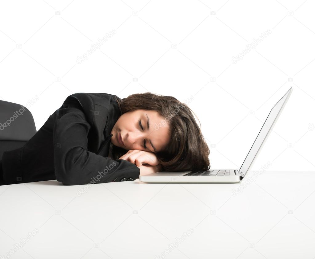 Woman exhausted from overwork sleeping 