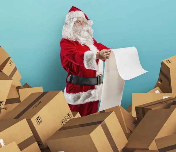 Santa Claus is full of presents request and boxes to delivery — Stock Photo, Image