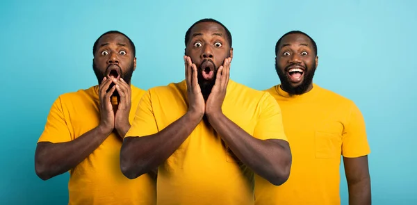 Hombre negro con expresión maravillada, sorprendida y feliz sobre fondo cian —  Fotos de Stock