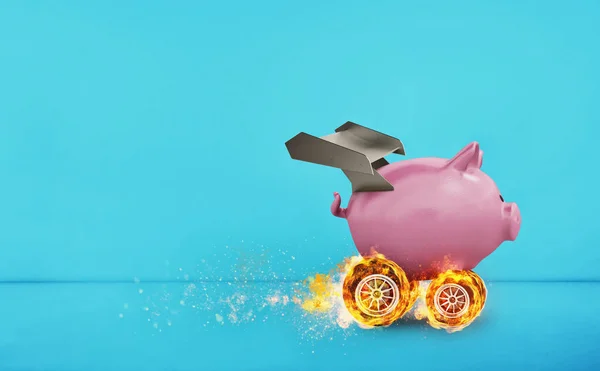 Piggy bank with wheel like a car. Concept of fast increse of money.cyan background — Stock Photo, Image