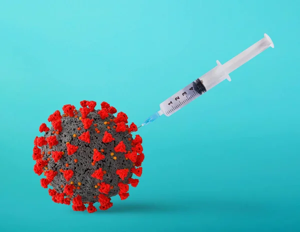 Syringe with Vaccine for virus coronavirus covid 19. Isolated on cyan background — Stock Photo, Image