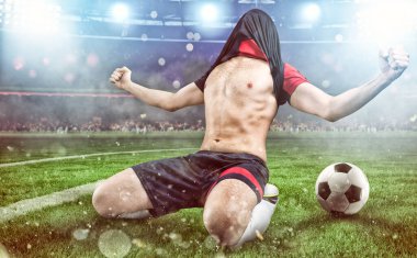 Soccer striker rejoices for the victory at the stadium clipart