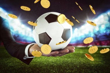 Spor bahisleri. Futbol stadyumunda bir iş adamının elinde tuttuğu bir futbol topuna para yağmuru.