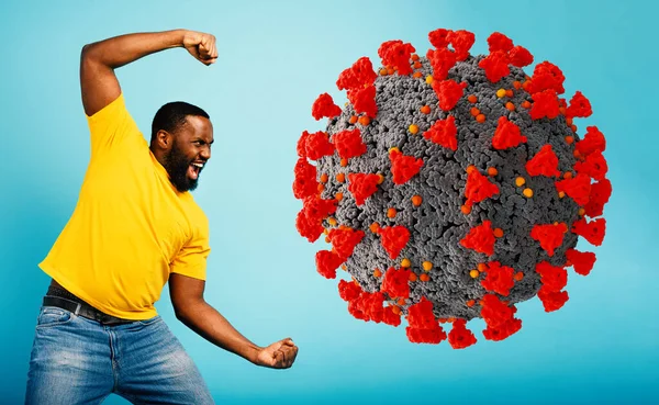 Man attacks with a punch the coronavirus. Blue background — Stock Photo, Image