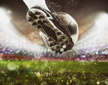 Football scene at night match with close up of a soccer shoe hitting the ball with power clipart