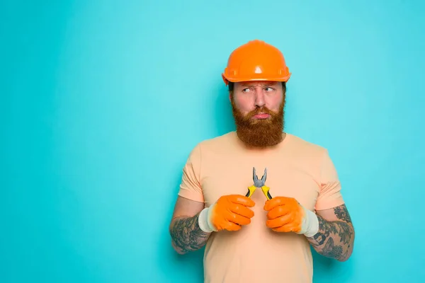 Incompetent worker is unsure and confused about his work — Stock Photo, Image